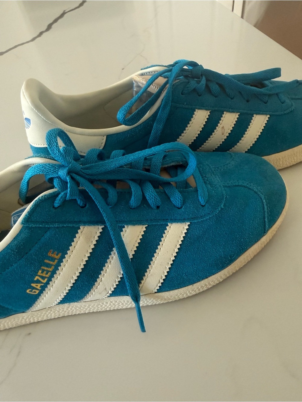 Adidas Gazelle low-top sneakers in a bold aqua